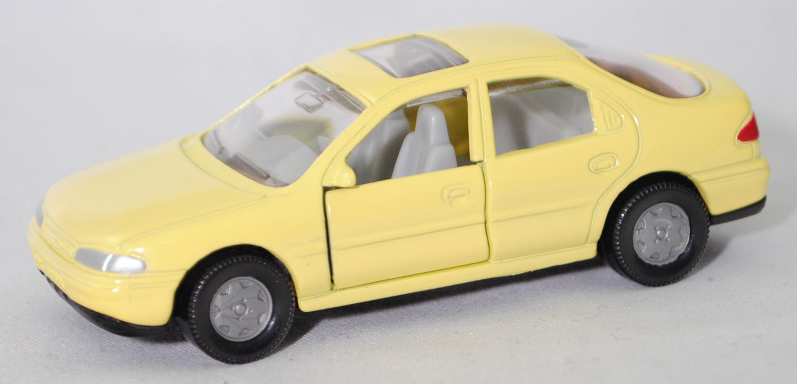 00000 Ford Mondeo Ghia 1.8 16V (1. Generation, Typ Mondeo '93 bzw. Mk I, interne Baureihenbezeichnung GBP, Modell 1993-1994), blassgelb, SIKU SUPER, 1:55, m