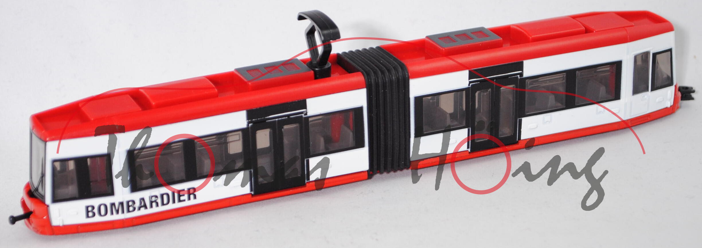 00003 Niederflurstraßenbahn BOMBARDIER FLEXITY Classic, rot/weiß, Türen schwarz, SIKU, 1:87, L17mpK