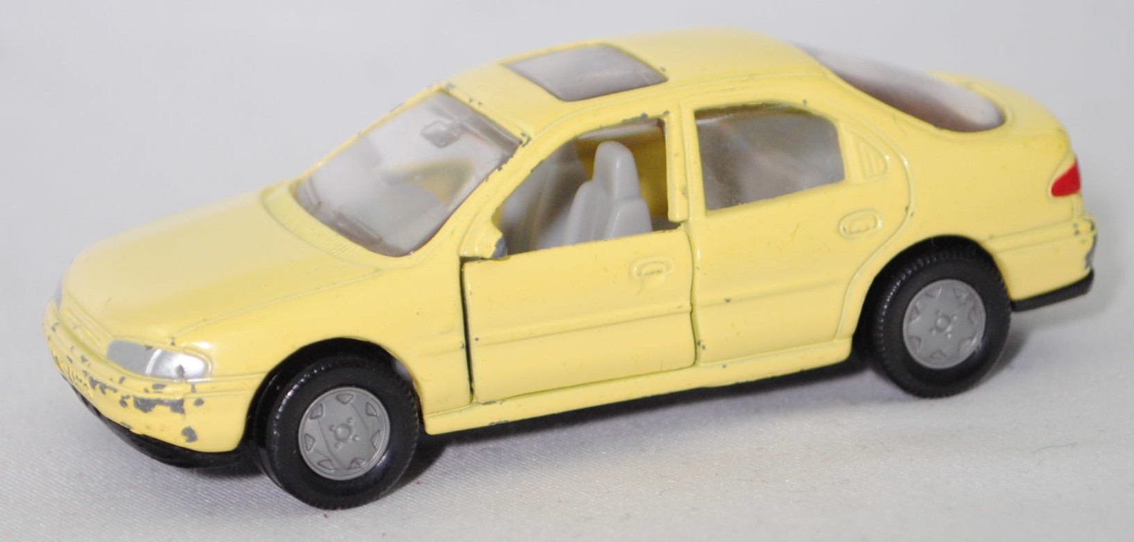 00000 Ford Mondeo Ghia 1.8 16V (1. Generation, Typ Mondeo '93 bzw. Mk I, interne Baureihenbezeichnung GBP, Modell 1993-1994), blassgelb, SIKU SUPER, 1:55, vsc
