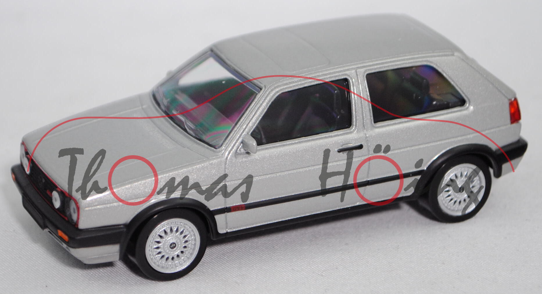 VW Golf GTI G60 (2. Gen., Typ 1G1, Facel. 2 1989, Mod. 90-91), diamantsilber met., Norev, 1:43, Box