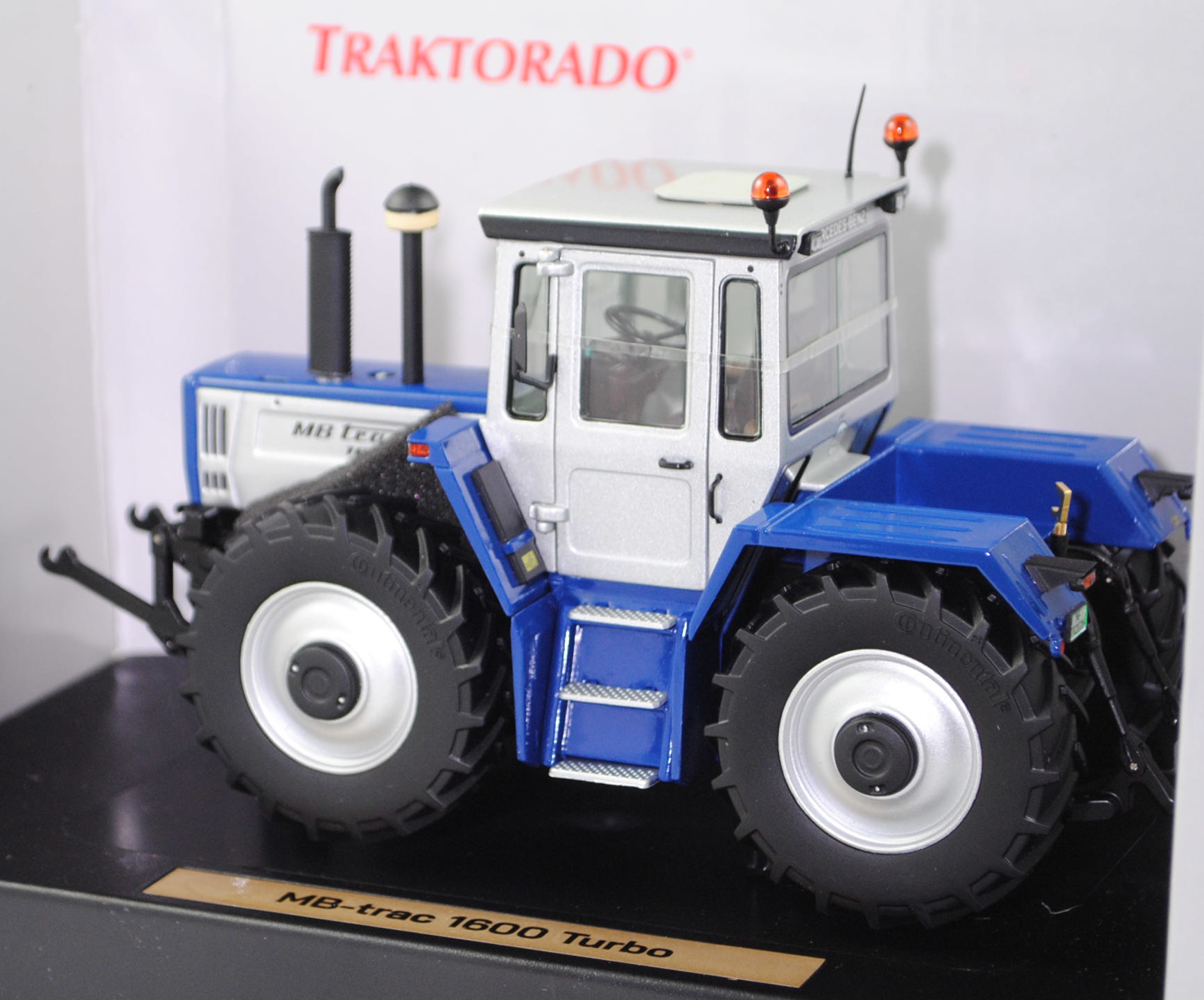 Mercedes-Benz MB trac 1600 turbo (Ausführung 1987-1991), silber/blau, Nummernschild NF TR2026, weise-toys by HOLLAND OTO, 1:32, mb (Limited Edition 750 pcs. TRAKTORADO® 2026)