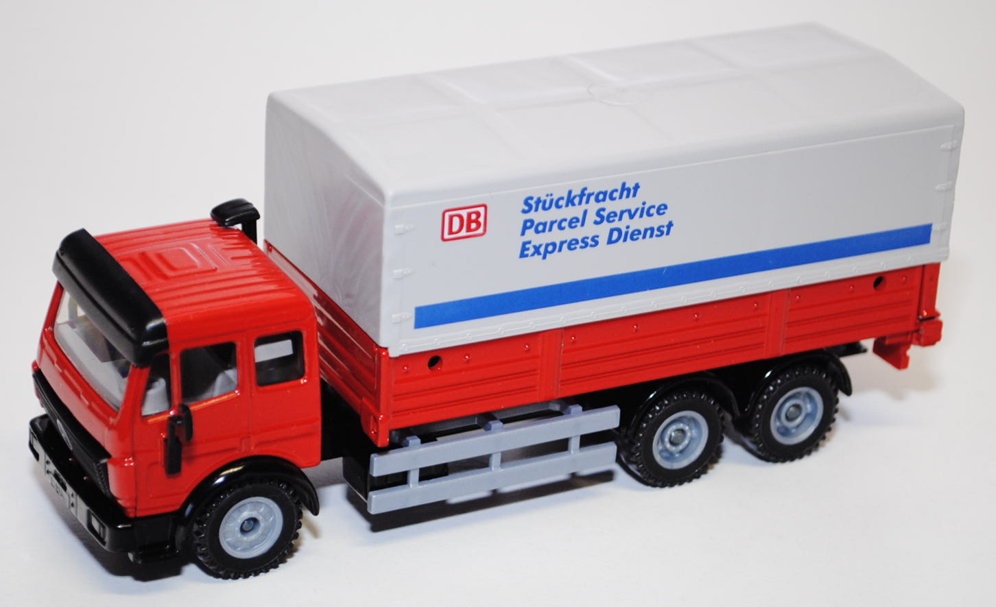 00001 Mercedes SK LKW mit Plane, rot/schwarz, DB / Stückfracht / Parcel Service / Express Dienst, L1