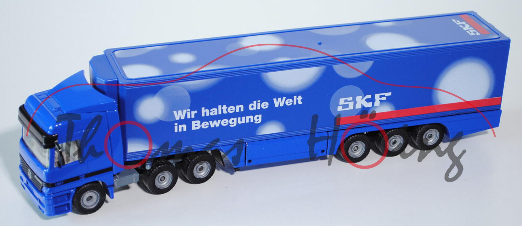 Mercedes Actros LH 1857 Koffer-Sattelzug, ultramarinblau/mausgrau, Wir halten die Welt / in Bewegung