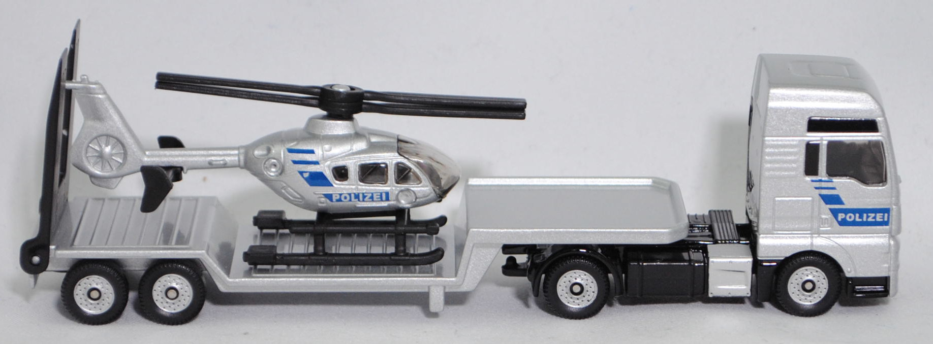 00000 MAN TGX 18.580 D38 XXL (Modell 2017-2019) mit Sattelauflieger und Polizei-Hubschrauber Eurocopter EC 135 T1 (Modell 1996-2002), silber, POLIZEI, SIKU SUPER 1:87, L17mpK