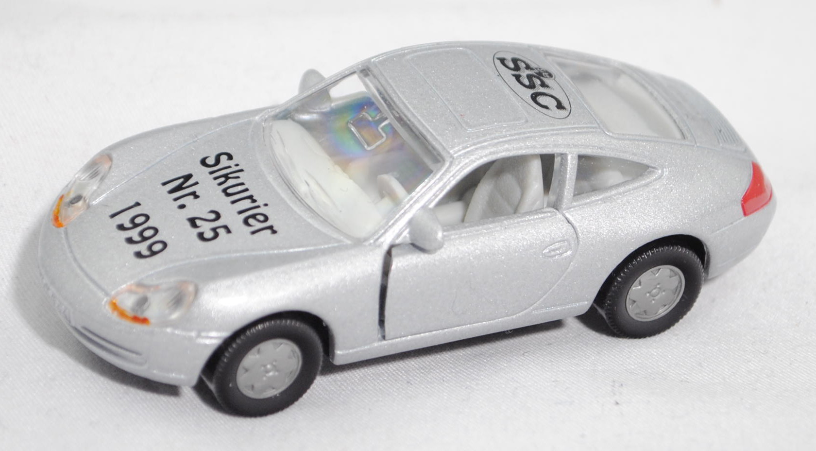 Porsche 911 Carrera (Typ 996, Mod. 1997-2001), silber, SSC-Logo + Sikurier / Nr. 25 / 1999, Limited