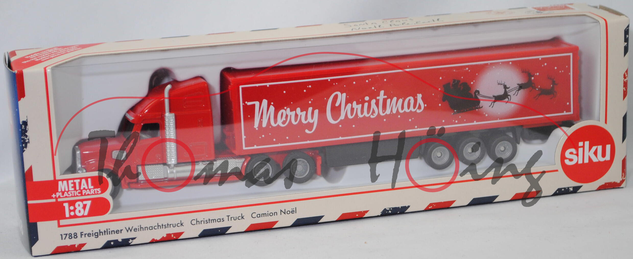 00000 FREIGHTLINER® CORONADO® CC132 (Modell 2001-2010) mit Koffer-Sattelauflieger (Weihnachtstruck), rot, Merry Christmas, SIKU, 1:87, L17mpK