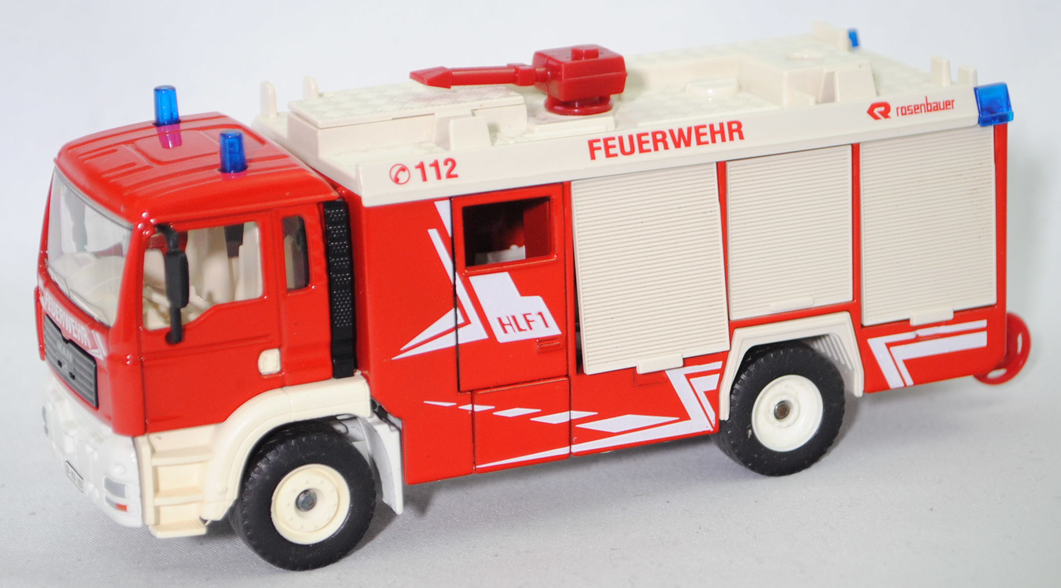 00001 HLF 20 auf Fahrgestell MAN TGA 18.460 M (Modell 2000-2004) Feuerwehr, rot/weiß, C 112 FEUERWEHR R rosenbauer / HLF1, SI - KU 103, SIKU, 1:55, m (Flutlichtmast und Leiter weg)