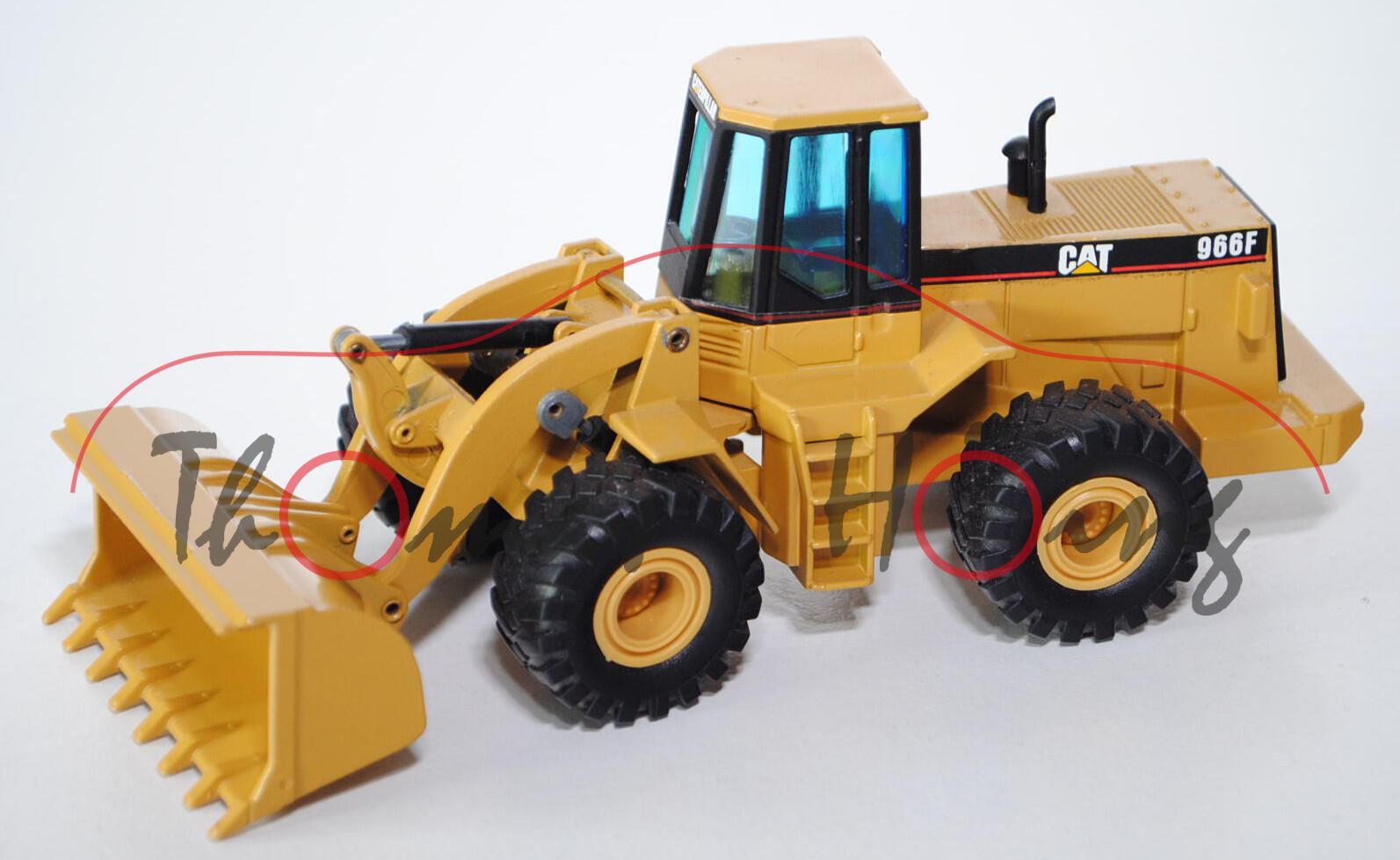 CATERPILLAR CAT® 966F Radlader, Modell 1990-1993, ockergelb, Halterung an der Schaufel gebrochen, 1: