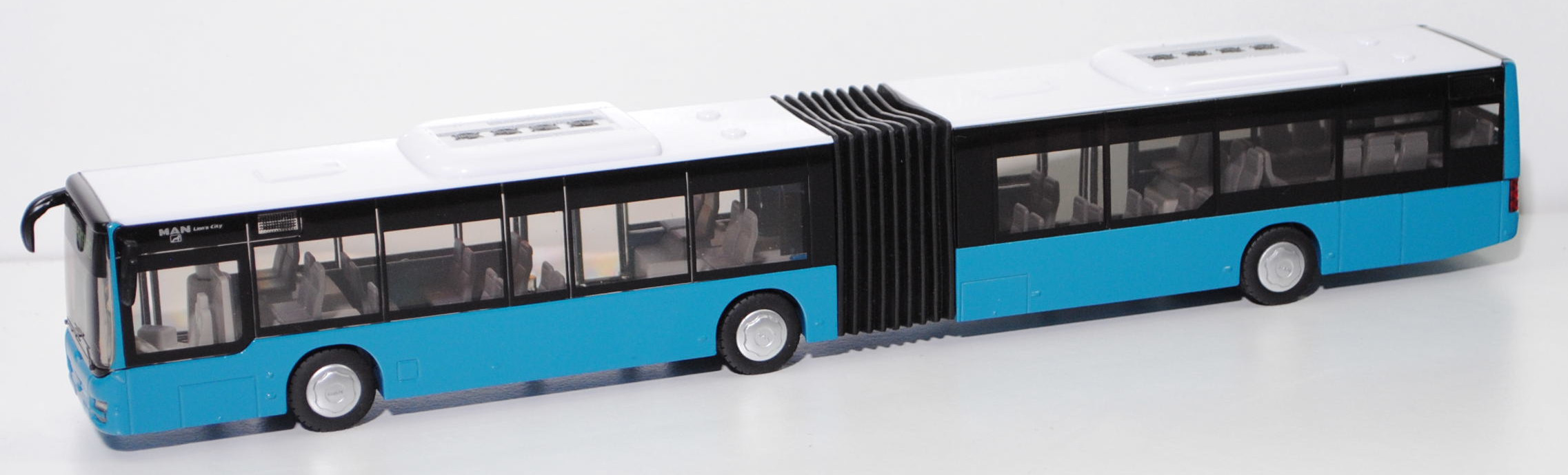 00005 MAN Lion's City G Gelenkbus (Typ A23, Modell 2004-2006), reinweiß/dunkel-miami blue, SIKU, 1:50, L17mpK