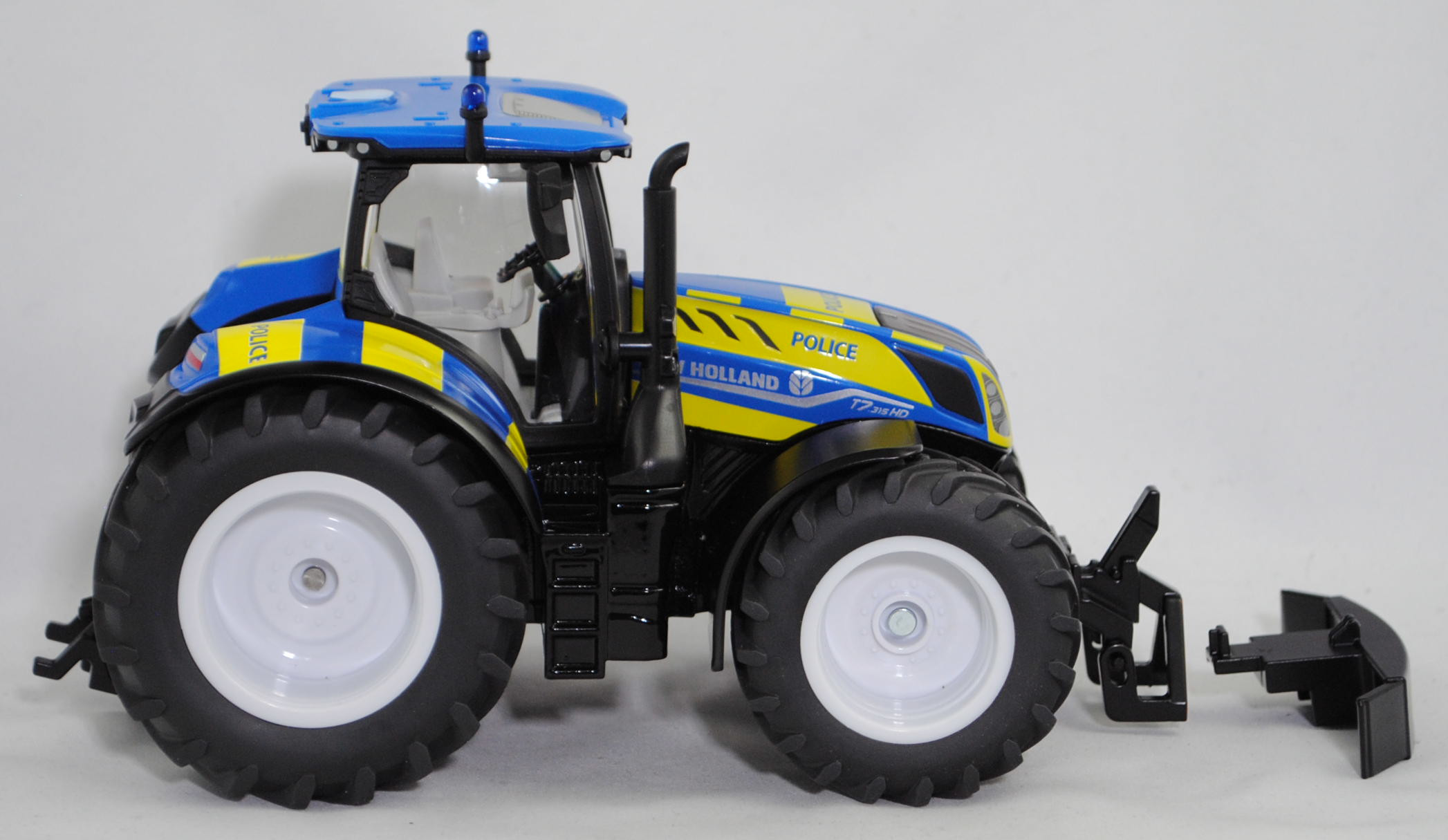 00000 New Holland T7.315 HD AC New Generation (2. Generation, Modell 2021-) Polizei Traktor, hell-signalblau/mattschwarz, POLICE, SIKU FARMER 1:32, L17mpK