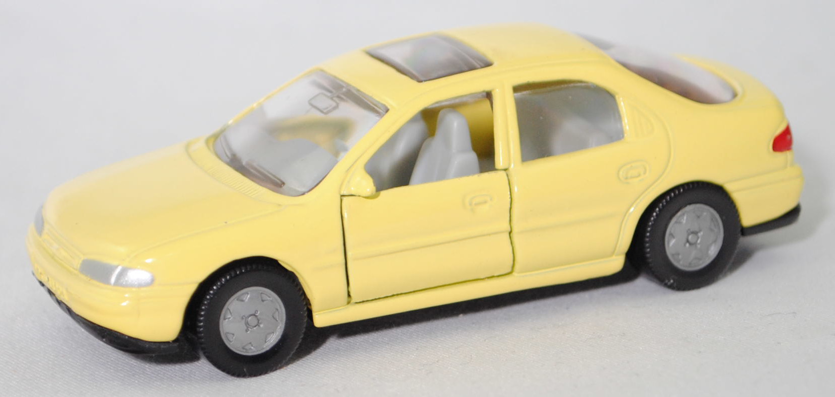 00001 Ford Mondeo Ghia 1.8 16V (1. Generation, Typ Mondeo '93 bzw. Mk I, interne Baureihenbezeichnung GBP, Modell 1993-1994), dunkel-blassgelb, SIKU SUPER, 1:55, m